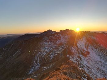 Scenic view of mountains against sky during sunset