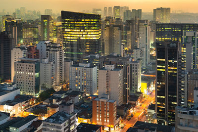 Aerial view of illuminated buildings in city