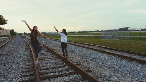 People walking on railroad track