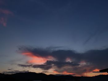 Low angle view of dramatic sky during sunset