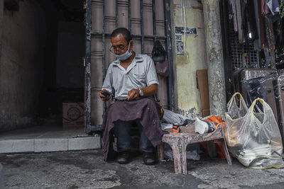 Rear view of man working 