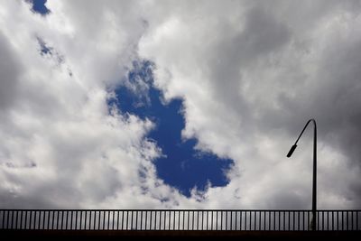 Low angle view of street and building against sky