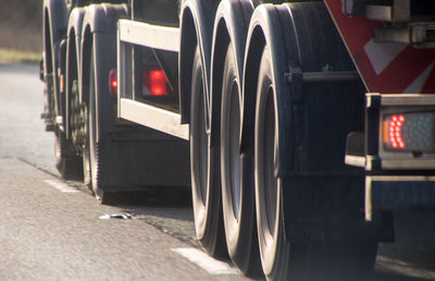 Close-up of a row of car on road