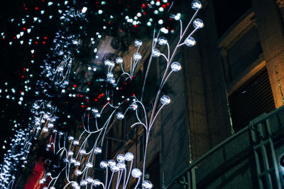 Low angle view of illuminated building at night
