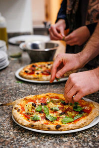 Midsection of man preparing food on table