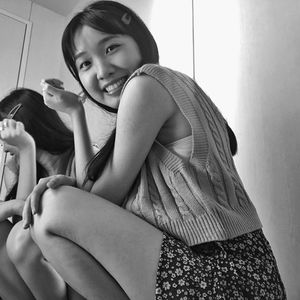 Portrait of happy woman sitting at home