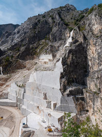 View of the carrara marble quarries with excavation vehicles ready for work.