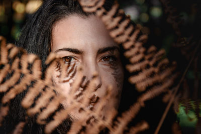 Woman portrait in the forest with autumn colours