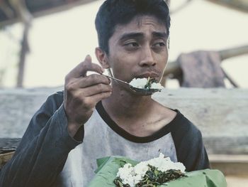 Portrait of man eating food
