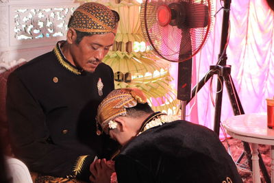 Men during wedding ceremony