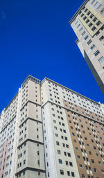 Low angle view of building against clear blue sky