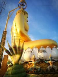 Low angle view of statue against sky