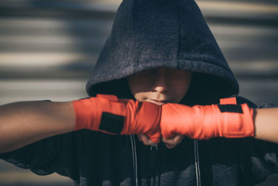 Close-up of boy wearing hooded jacket