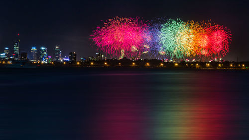 Firework display at night