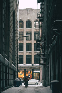 Woman in city during winter