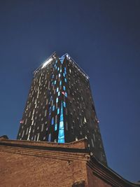 Low angle view of historical building against clear blue sky