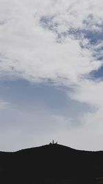 Low angle view of silhouette mountain against sky