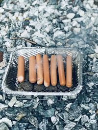 High angle view of cigarette in snow on land