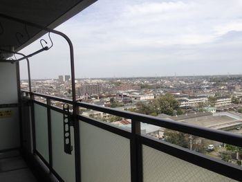 High angle view of buildings in city against sky