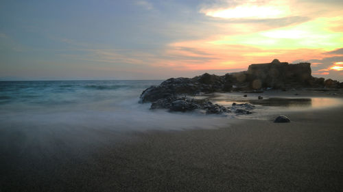 Scenic view of sea against sky during sunset