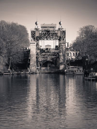 View of bridge over river in city