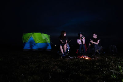 Group of people in the dark
