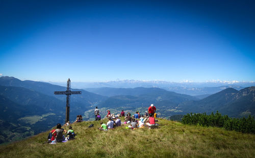 Scenic view of mountains against blue sky