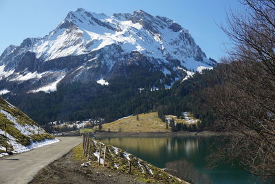 Scenic view of snowcapped mountains against sky