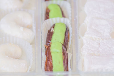 Traditional turkish delight in a plastic box. assorted oriental sweets.