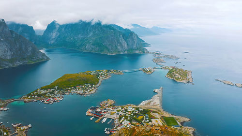 Scenic view of sea and mountains against sky ,reine, lofoten, norway 