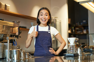 Portrait of young woman using mobile phone