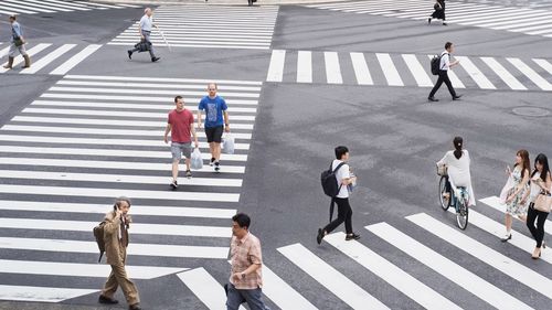 High angle view of people crossing road