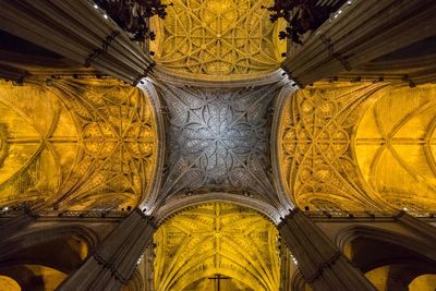 Low angle view of yellow ceiling of building