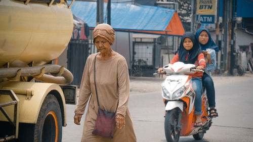 Portrait of men on road in city