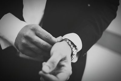 Close-up mid section of a man in suit