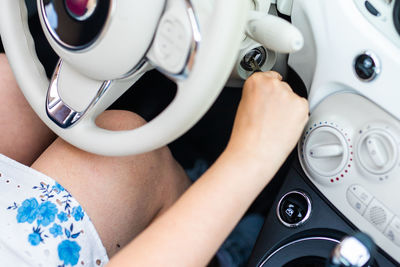 Cropped hands of woman using mobile phone