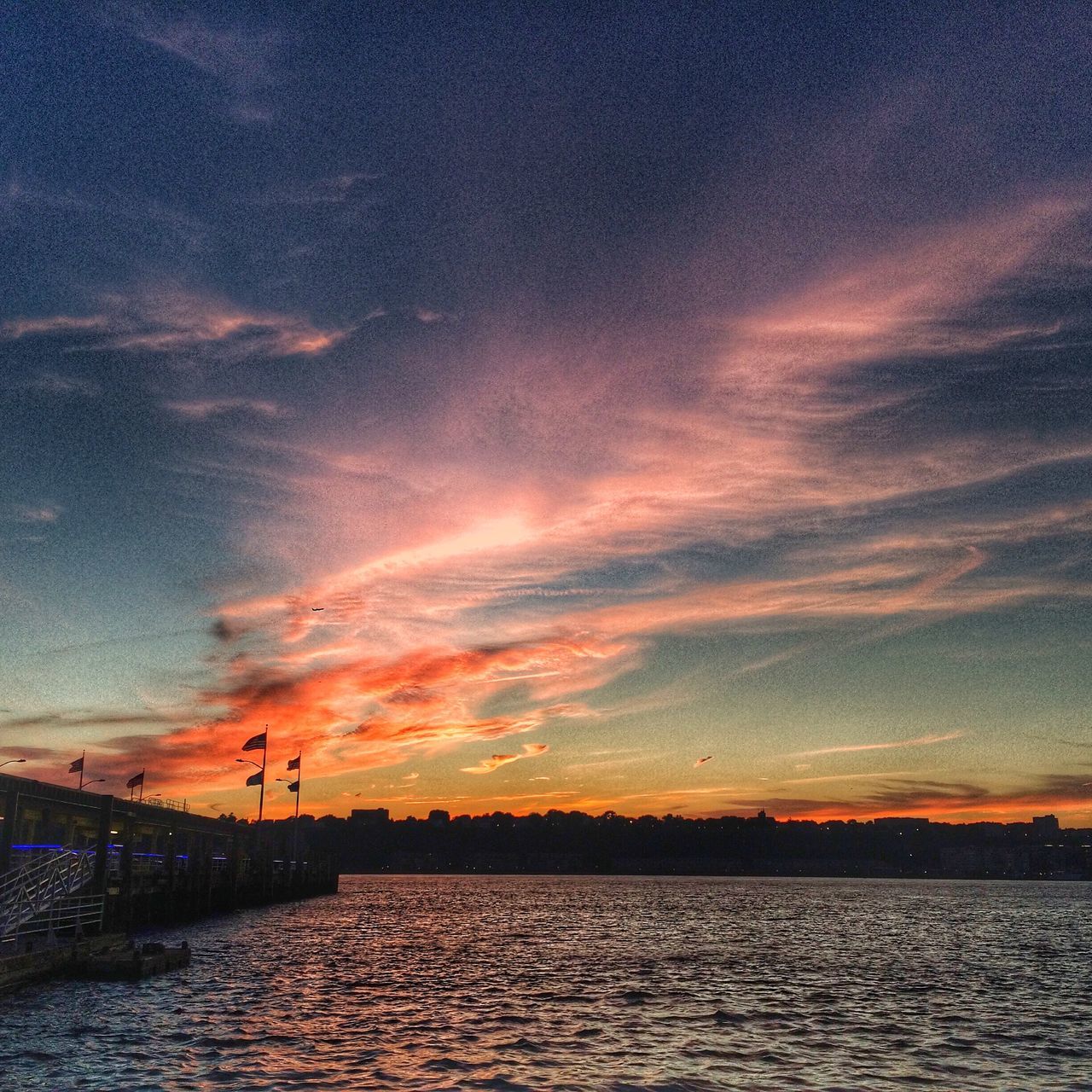 sunset, water, sky, scenics, tranquil scene, sea, tranquility, beauty in nature, waterfront, orange color, nature, cloud - sky, silhouette, idyllic, rippled, cloud, reflection, outdoors, dramatic sky, built structure