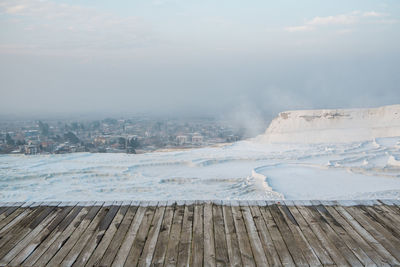 Scenic view of landscape against sky during winter