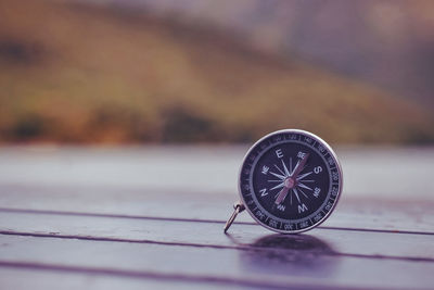 Close-up of arrow symbol on table