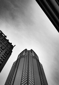 Low angle view of office building against sky