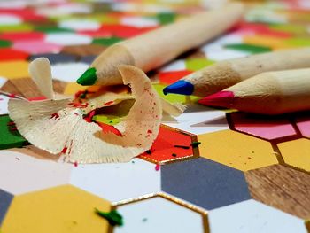 Close-up of multi colored pencils on table