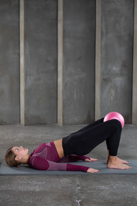 Low section of woman exercising in gym