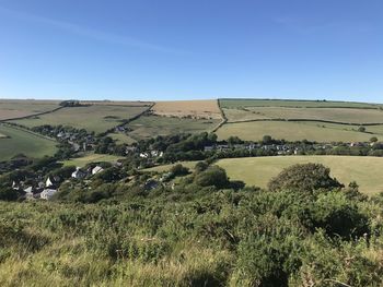 Scenic view of landscape against clear blue sky