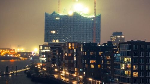 Illuminated buildings in city at night