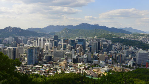 High angle view of buildings in city against sky