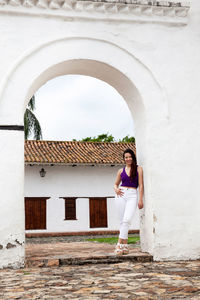 Beautiful young woman at the historical la merced church in the cali city downtown in colombia