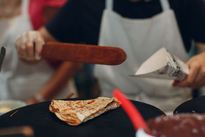 Midsection of chef preparing food