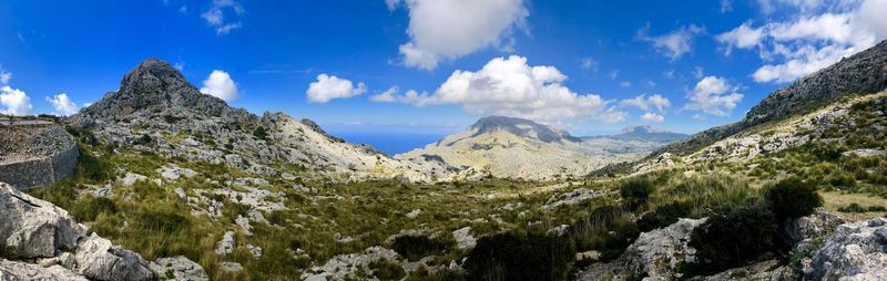 Panoramic view of rocky mountains against sky