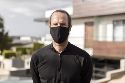 Man wearing black fabric mask