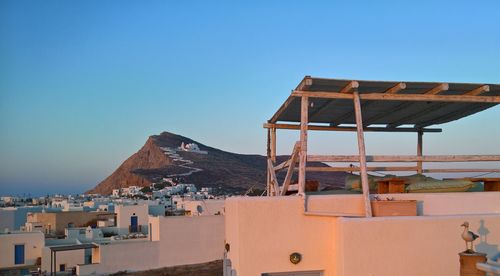 View of townscape against clear blue sky